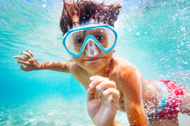 mp29148135-happy-boy-in-scuba-mask-swimming-underwater.jpg